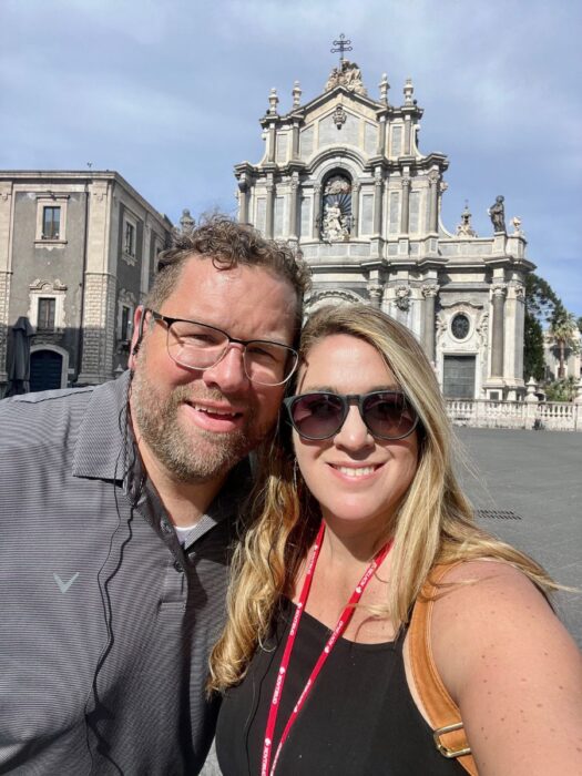 couple in front of church in Greece