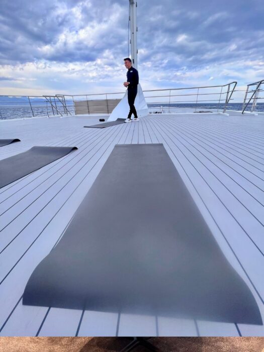 yoga on the deck of the Emerald Azzurra luxury yacht