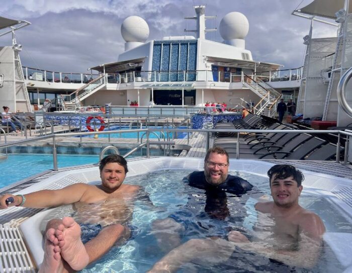 father and sons in hot tub on Celebrity Eclipse