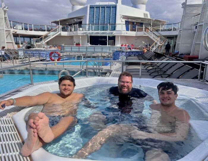 father and sons in hot tub on cruise