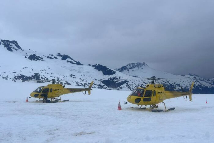 helicopters on a glacier 