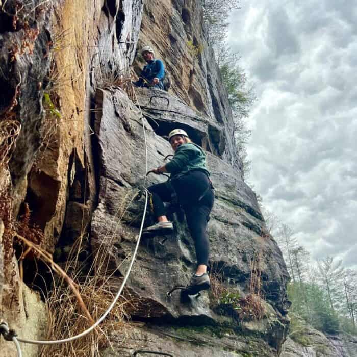 man and woman climbing Via ferrata with Southeast Mountain Guides in Kentucky
