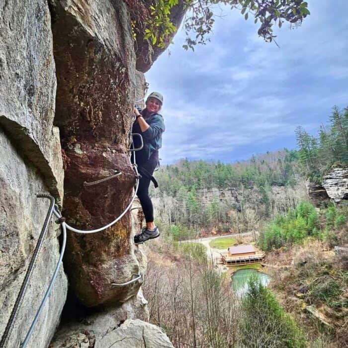 woman climbing via ferrata at Southeast Mountain Guides 