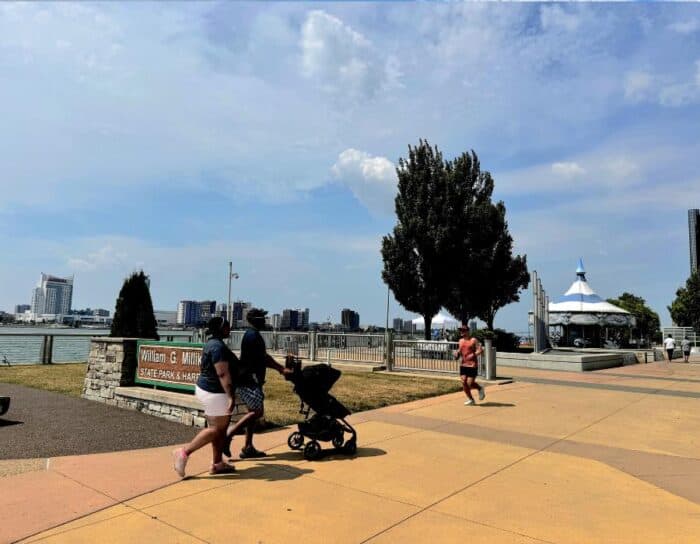 family walking along Detroit Riverwalk