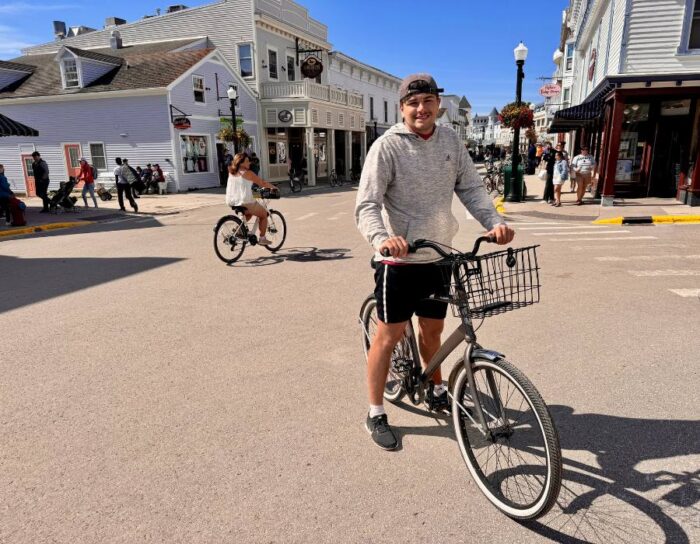 young man on a bicycle on Mackinac Island 