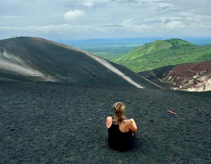 woman at the top of Cerro Negro Volcano in Nicaragua 