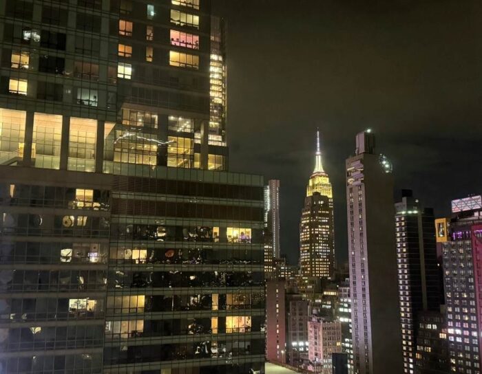 View of Empire State Building from room at Pod Times Square at night