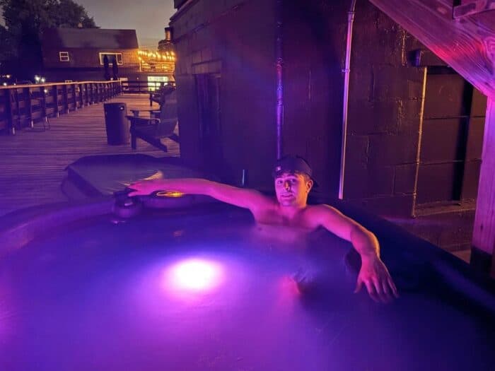 young man in hot tub at SoLSTAY Lodging and Marina in Sandusky OH